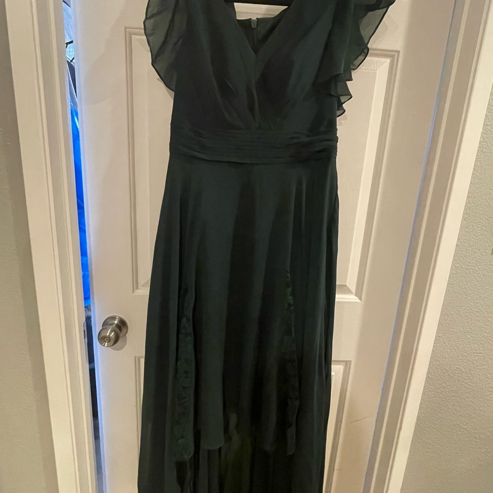 Green prom dress. Short in the front and longer train in the back.